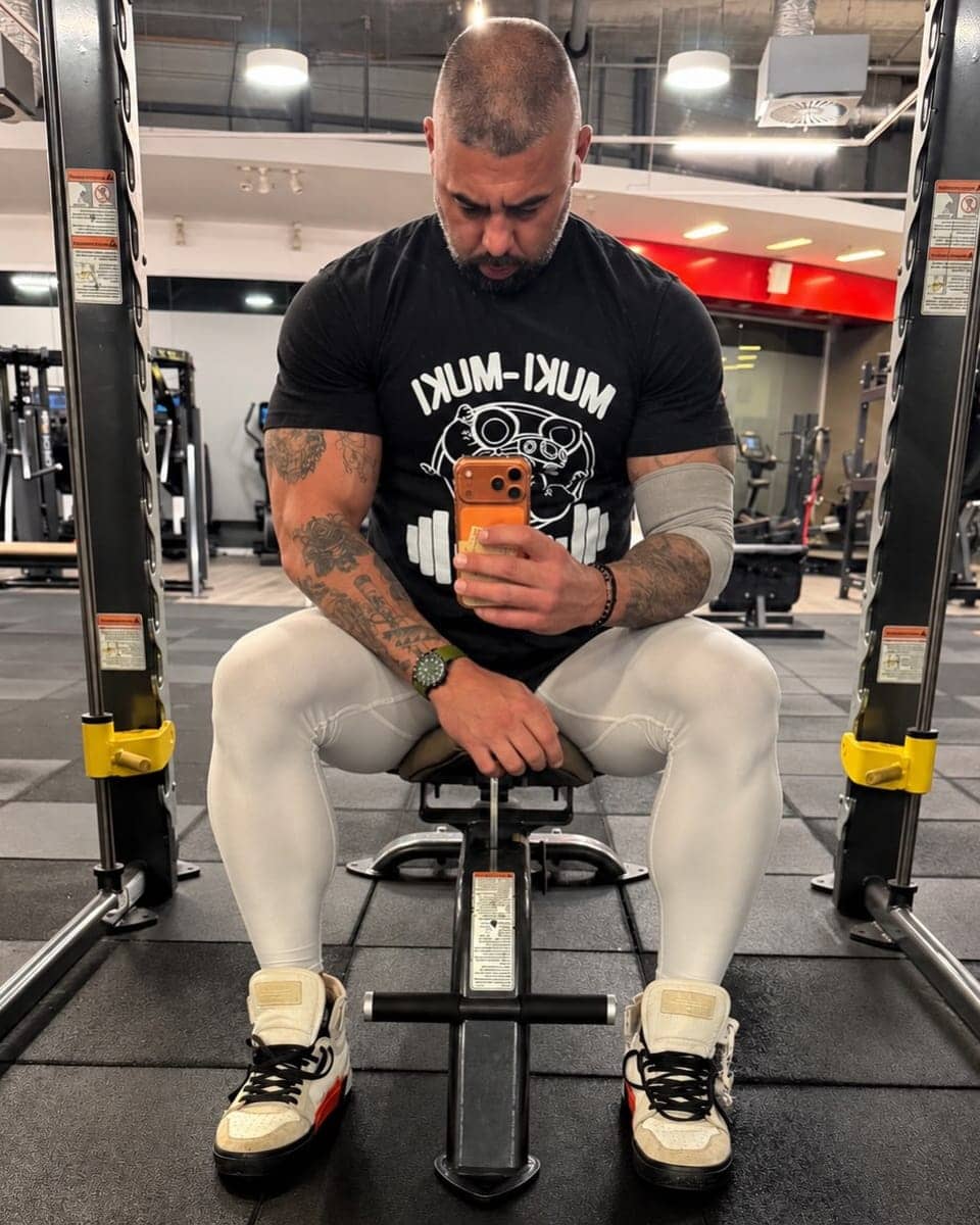 PrivateBite Bali personal trainer seated between sets in the gym